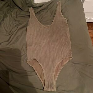 green body suit (looks brown bc of my bedding but is green) size M/L, never worn